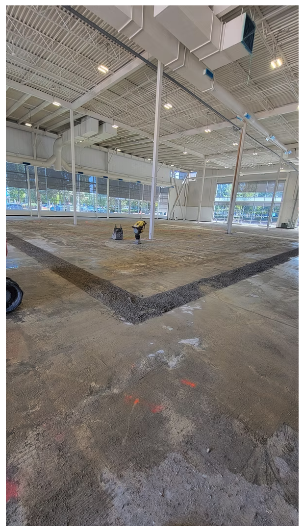 Precision concrete slab saw cut and interior trench prepared for new plumbing rough-in
